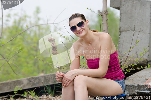 Image of Young girl with a skewer and barbecue