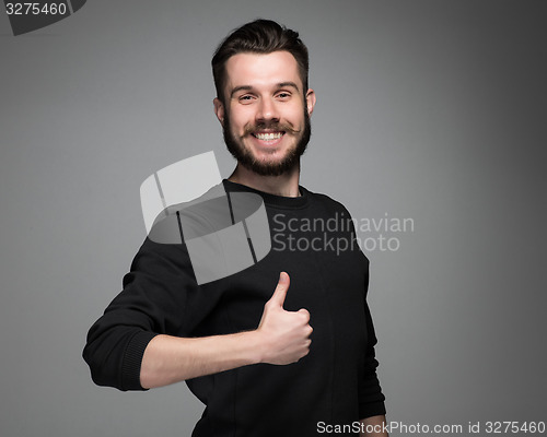 Image of portrait of handsome young smiling man