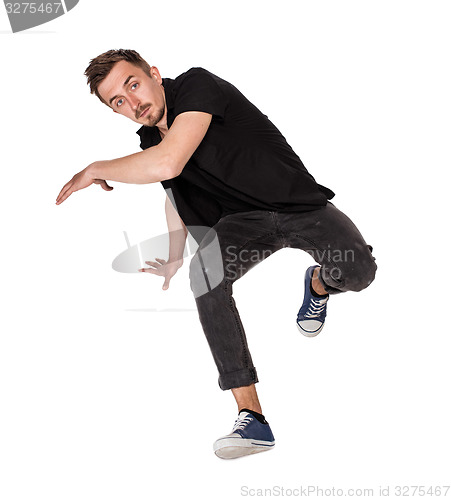 Image of Break dancer doing one handed handstand against a white background