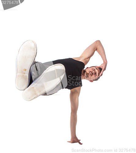 Image of Break dancer doing one handed handstand against a white background