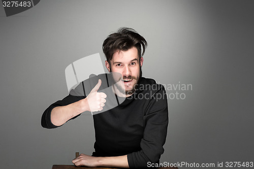 Image of portrait of handsome young smiling man