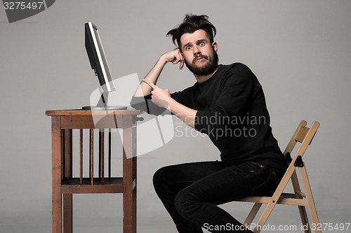 Image of Funny and crazy man using a computer