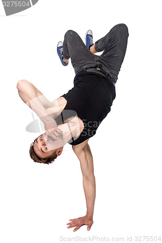 Image of Break dancer doing one handed handstand against a white background