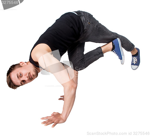 Image of Break dancer doing handstand against  white background