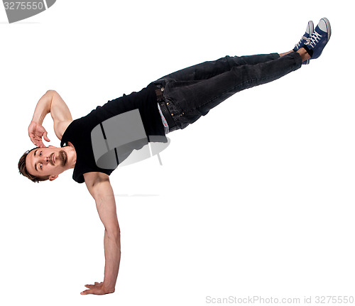 Image of Break dancer doing one handed handstand against a white background