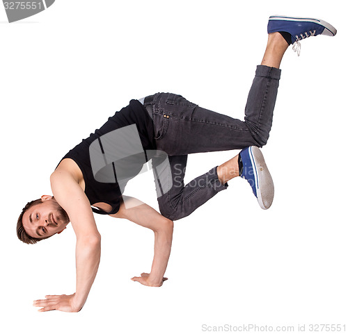 Image of Break dancer doing handstand against  white background