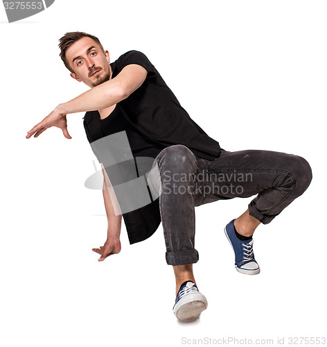 Image of Break dancer doing one handed handstand against a white background