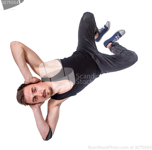 Image of Break dancer doing one handed handstand against a white background