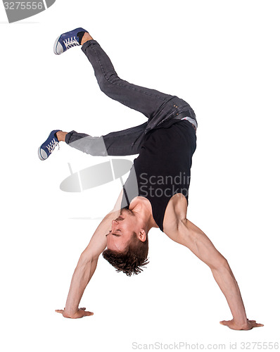 Image of Break dancer doing handstand against  white background