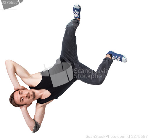 Image of Break dancer doing one handed handstand against a white background