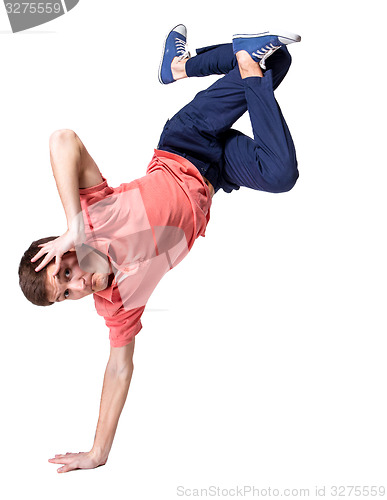 Image of Break dancer doing one handed handstand against a white background