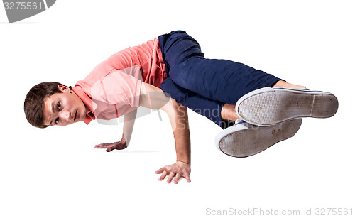 Image of Break dancer doing handstand against  white background
