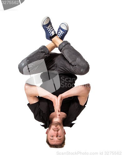 Image of Young handsome fresh man breakdancing on white background