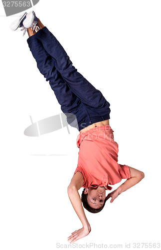 Image of Break dancer doing one handed handstand against a white background