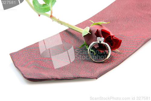 Image of red tie and gold ring