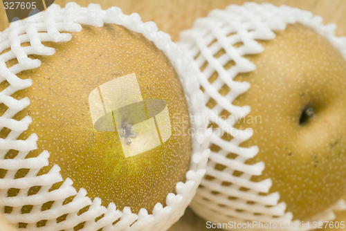 Image of asian pears in shipping net