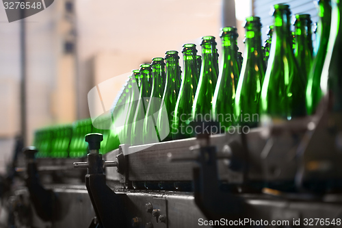 Image of Many bottles on conveyor belt