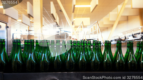 Image of Many bottles on conveyor belt