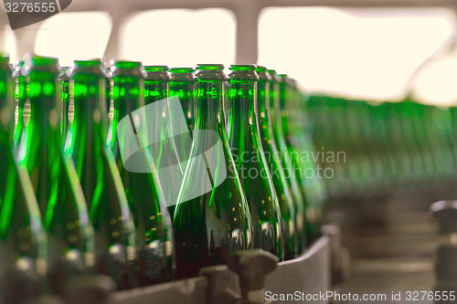 Image of Many bottles on conveyor belt