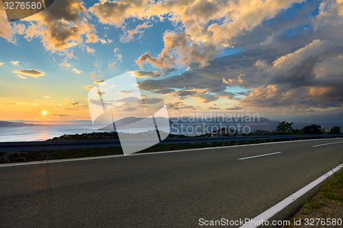 Image of Beautiful coastal road at sunset