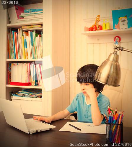 Image of schoolboy doing homework