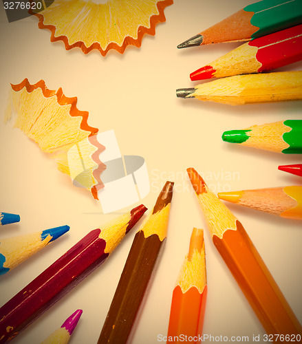 Image of several colored pencils and shavings