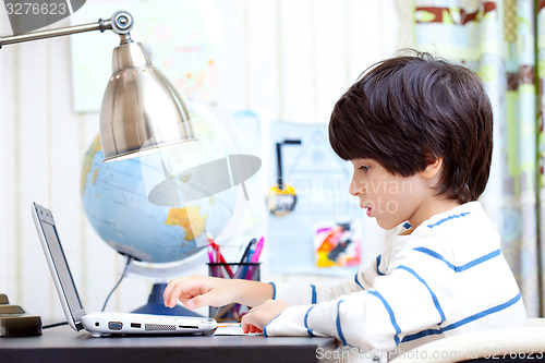 Image of schoolchild working on a computer