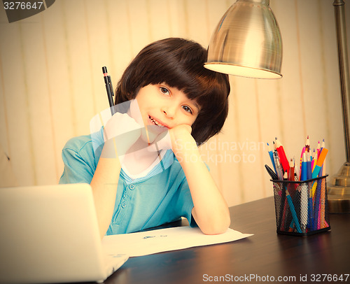 Image of schoolboy doing homework