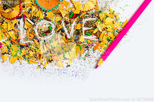 Image of The word Love on colored pencil shavings
