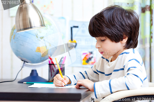 Image of schoolboy doing homework