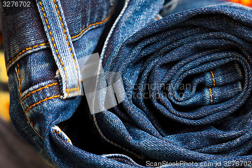 Image of rolled jeans trousers 