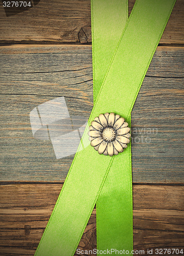 Image of Vintage metal button flower and two green tape