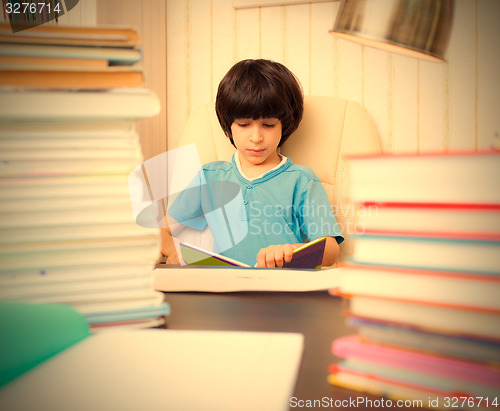 Image of boy reading a book