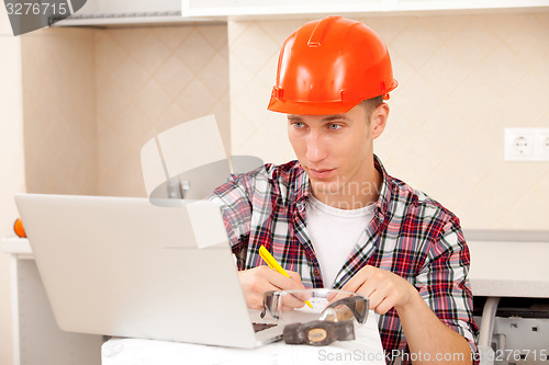 Image of Engineer calculates estimates for repair