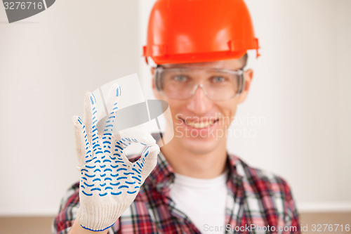 Image of master making a perfect gesture with his gloved hand