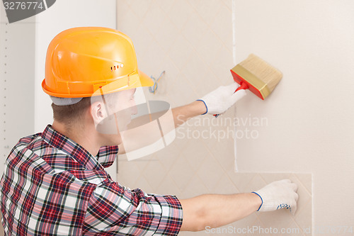 Image of worker with paint brush