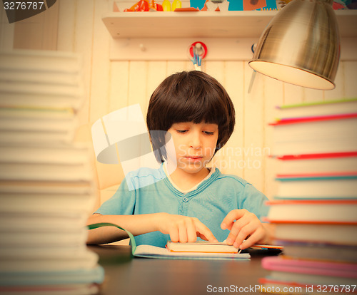 Image of child reading a book