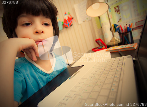 Image of distance learning, preschool child with computer