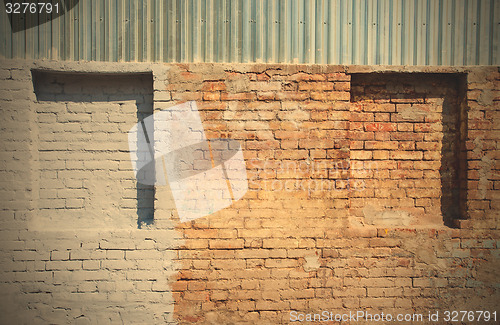 Image of old brick wall with blind windows