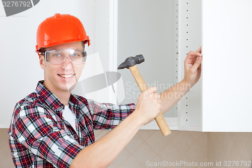 Image of worker with a hammer