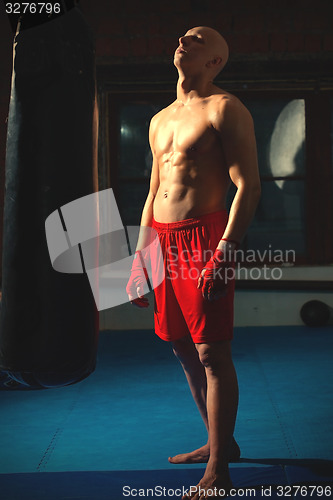 Image of athlete in red shorts