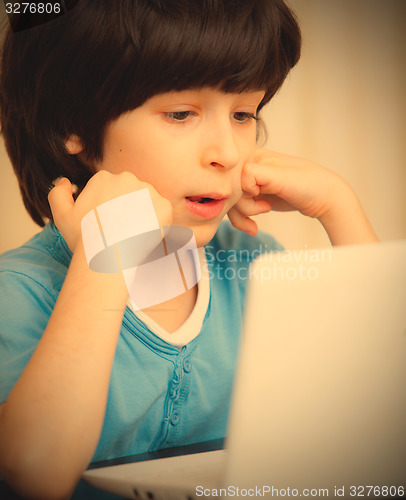Image of boy with white notebook