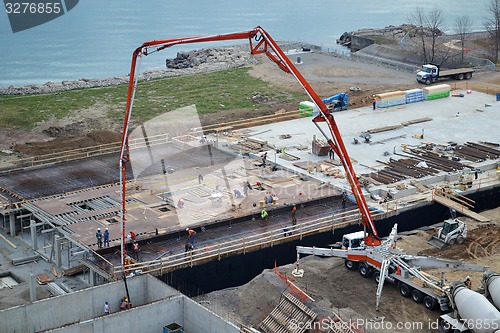 Image of Pouring concrete on construction side.