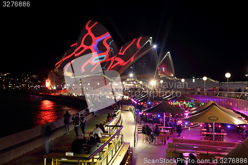 Image of Sydney Opera House and Opera Bar in foreground Vivid Sydney