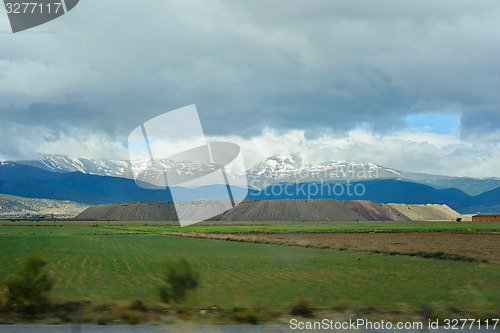 Image of Mountains tops in snow on the background