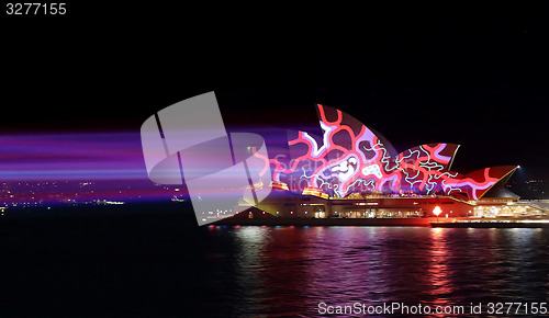 Image of Colourful red and blue light beams on Sydney Opera House