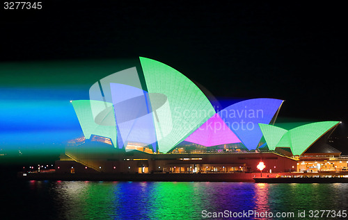 Image of Sydney Opera House shines in green and blue