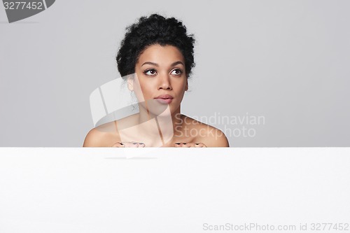 Image of Beauty woman showing blank whiteboard