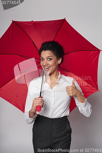 Image of Happy woman with umbrella