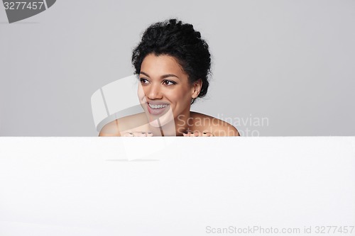 Image of Beauty woman showing blank whiteboard